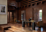 Ricci marble dining table in a wood panelled interior
