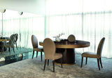 Touched D round gloss walnut dining table with lazy susan and drum base in a light filled dining room