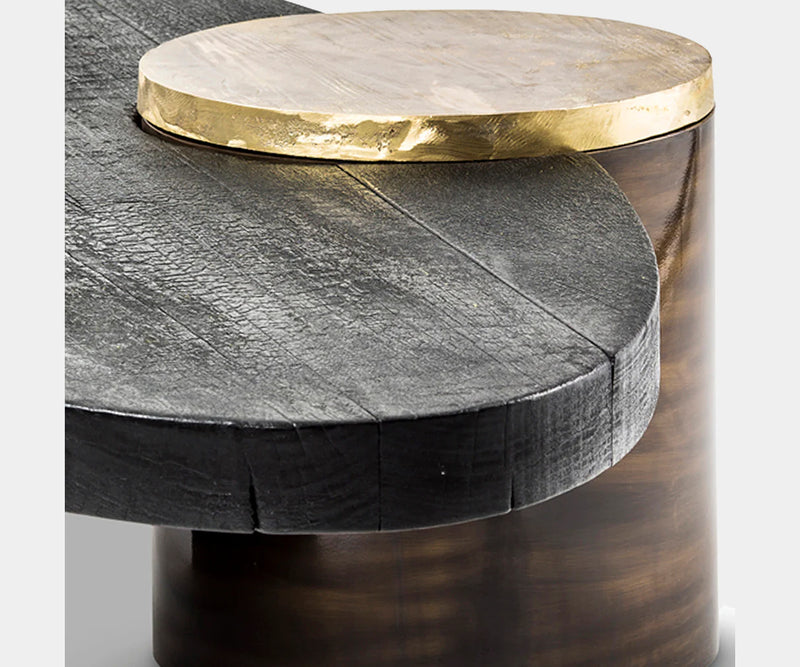 High-end Primal Coffee Table with dark, charred Shou Sugi Ban wood and solid cast brass base, adding a touch of sophistication to luxury living spaces.