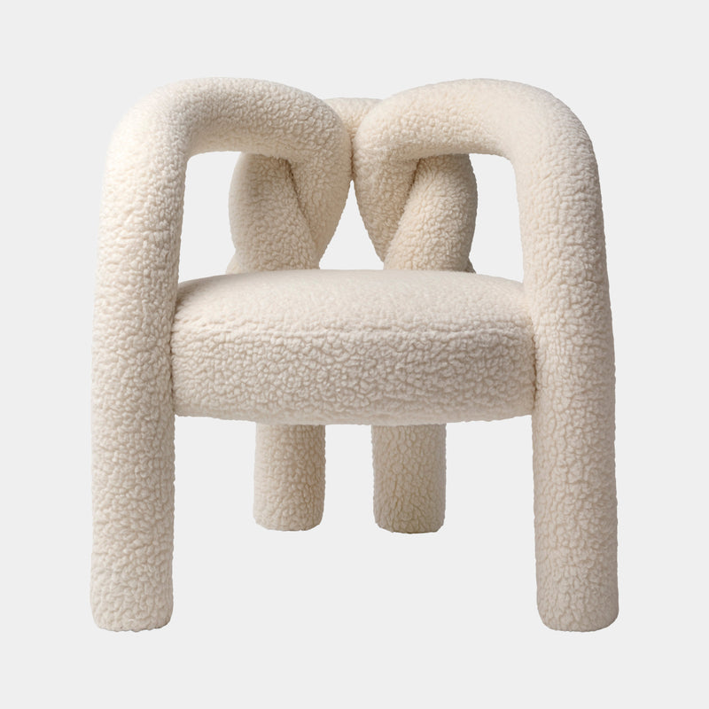 Visionnaire Shibari Armchair: Modern luxury armchair with a unique love knot design and plush teddy bear fabric upholstery.