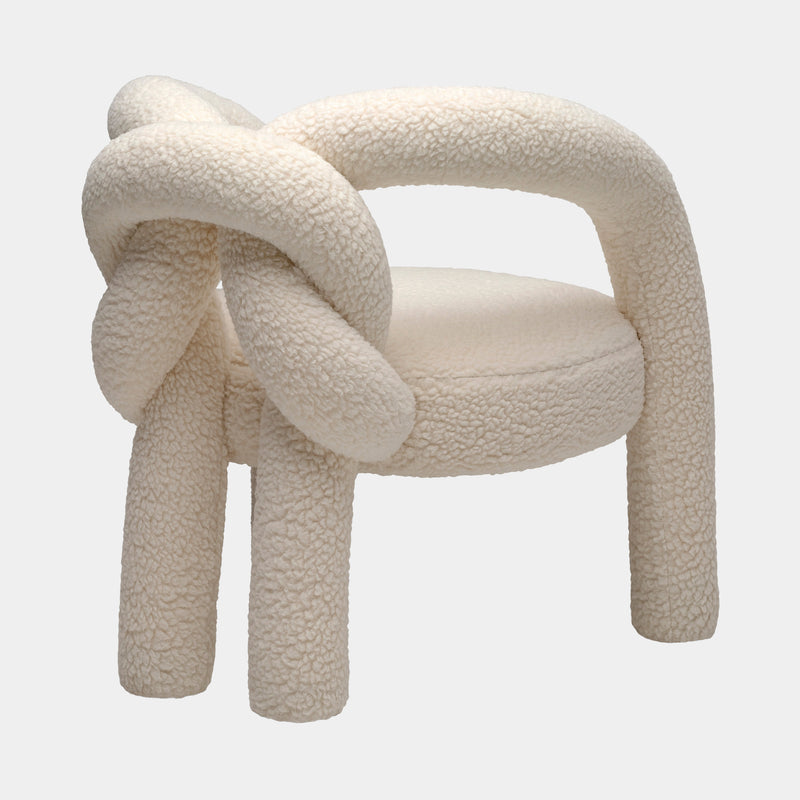 Teddy Bear Fabric Armchair: The Visionnaire Shibari Armchair features a unique love knot design and is upholstered in a plush, teddy bear-like fabric.