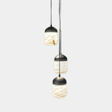 United Alabaster Glans Pendant Light in three natural alabaster shades with matt black caps, studio view on grey