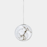 United Alabaster Moon Pendant Light in natural alabaster with a satin gold brass stem, studio view on grey