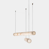 United Alabaster Tube Pendant Light in natural alabaster, studio view on grey