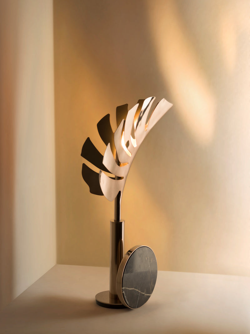 Laser-Cut Metal Table Lamp Design: The Callia Table Lamp by Visionnaire showcases intricate laser-cut metalwork, creating a unique leaf-shaped diffuser.