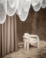 Comfortable Modern Armchair: The Shibari Armchair by Visionnaire combines innovative design with exceptional comfort. The teddy bear fabric and curved back provide ultimate relaxation.