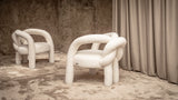 Visionnaire Shibari Armchair Details: Close-up view of the Shibari Armchair's love knot metal frame, showcasing the meticulous craftsmanship and high-density polyurethane foam padding.