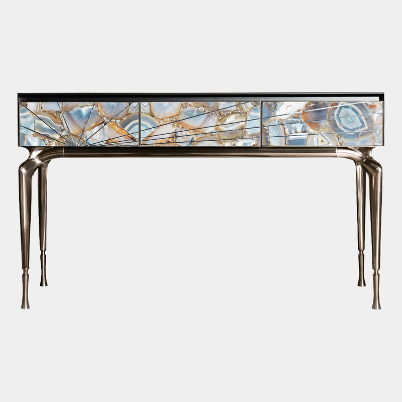 Visionnaire's Aurora Console: A radiant masterpiece for the discerning homeowner. This Italian-designed console features brushed stainless steel drawers with a captivating marble inlay, customizable metal finishes, and sleek aluminum legs for a touch of modern luxury.