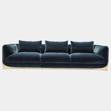 Visionnaire's Ca' Foscari Sofa: Award-Winning Design & Unparalleled Comfort. This modern sofa, designed by Alessandro La Spada (winner of the Archiproducts Design Awards 2022 for Sustainability), features a contrasting interplay of a curved stainless steel base and soft velvet upholstery (other upholstery options available). Memory Foam® comfort and loose feather cushions create a luxurious haven for relaxation.