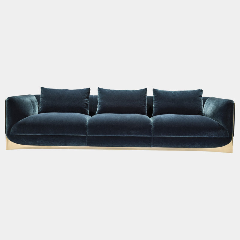 Visionnaire's Ca' Foscari Sofa: Award-Winning Design & Unparalleled Comfort. This modern sofa, designed by Alessandro La Spada (winner of the Archiproducts Design Awards 2022 for Sustainability), features a contrasting interplay of a curved stainless steel base and soft velvet upholstery (other upholstery options available). Memory Foam® comfort and loose feather cushions create a luxurious haven for relaxation.