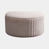 Luxury round pouf with channel quilted upholstery and goose down seat