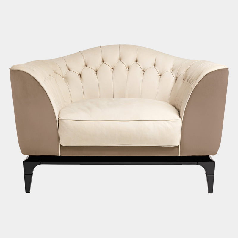 Visionnaire Freyr Armchair: Modern luxury armchair with a curved shell, plush upholstery (leather or fabric options), and slender wooden feet with metal tips.