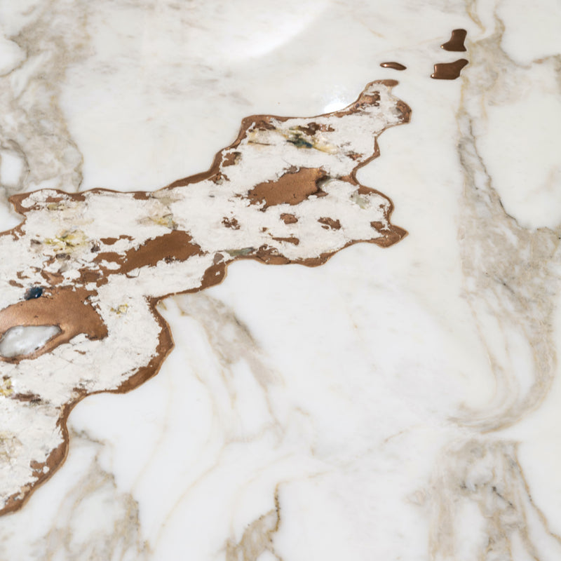 Elevate Your Dining Experience: The Galitsin Table. Visionnaire's masterpiece combines a luxurious marble top with a captivating artistic insert, transforming your dining room into a gallery-worthy space.