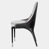 Luxury Italian Dining Seating: The Palmyra Chair by Visionnaire offers a sculptural statement piece for your dining room. This chair boasts exceptional comfort with its curved back, memory foam seat, and bespoke upholstery options.