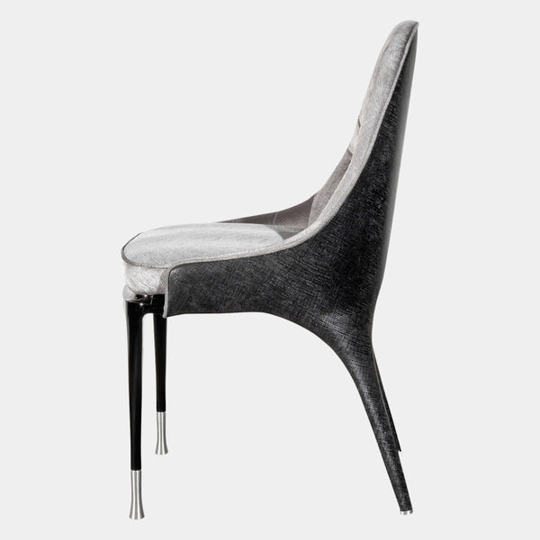 Luxury Italian Dining Seating: The Palmyra Chair by Visionnaire offers a sculptural statement piece for your dining room. This chair boasts exceptional comfort with its curved back, memory foam seat, and bespoke upholstery options.