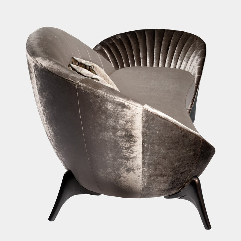 Art Meets Comfort: The Presence Sofa by Steve Leung. Visionnaire's masterpiece boasts an asymmetrical design, a captivatingly divided backrest with quilted details, and a variety of upholstery and finish options to create a statement piece for any living space.