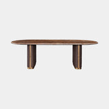 Luxury dining table with Rainforest Brown marble top on diamond quilted leather pillars with brass