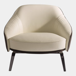 Visionnaire's Whitney Armchair: Ergonomic Comfort Meets Artistic Design. This modern armchair boasts a curved frame for exceptional support, luxurious canneté quilted fabric upholstery with contrasting leather accents, and a customisable stainless steel base. Perfect for any discerning luxury interior design enthusiast.